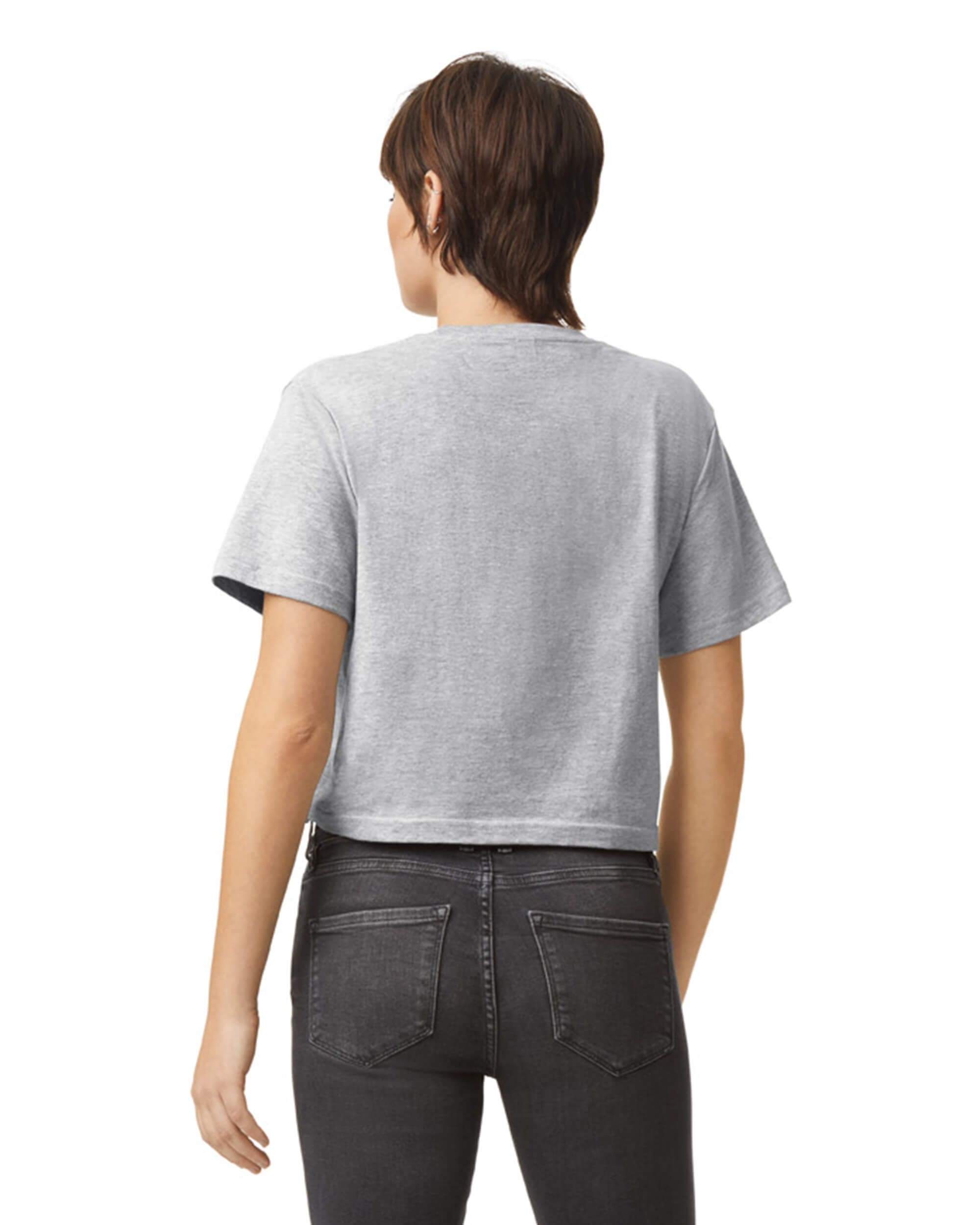 Female model wearing an American Apparel Fine Jersey Women's Boxy Tee in Heather Sport Grey, paired with black jeans, standing against a plain background (back pose) -heather sport grey