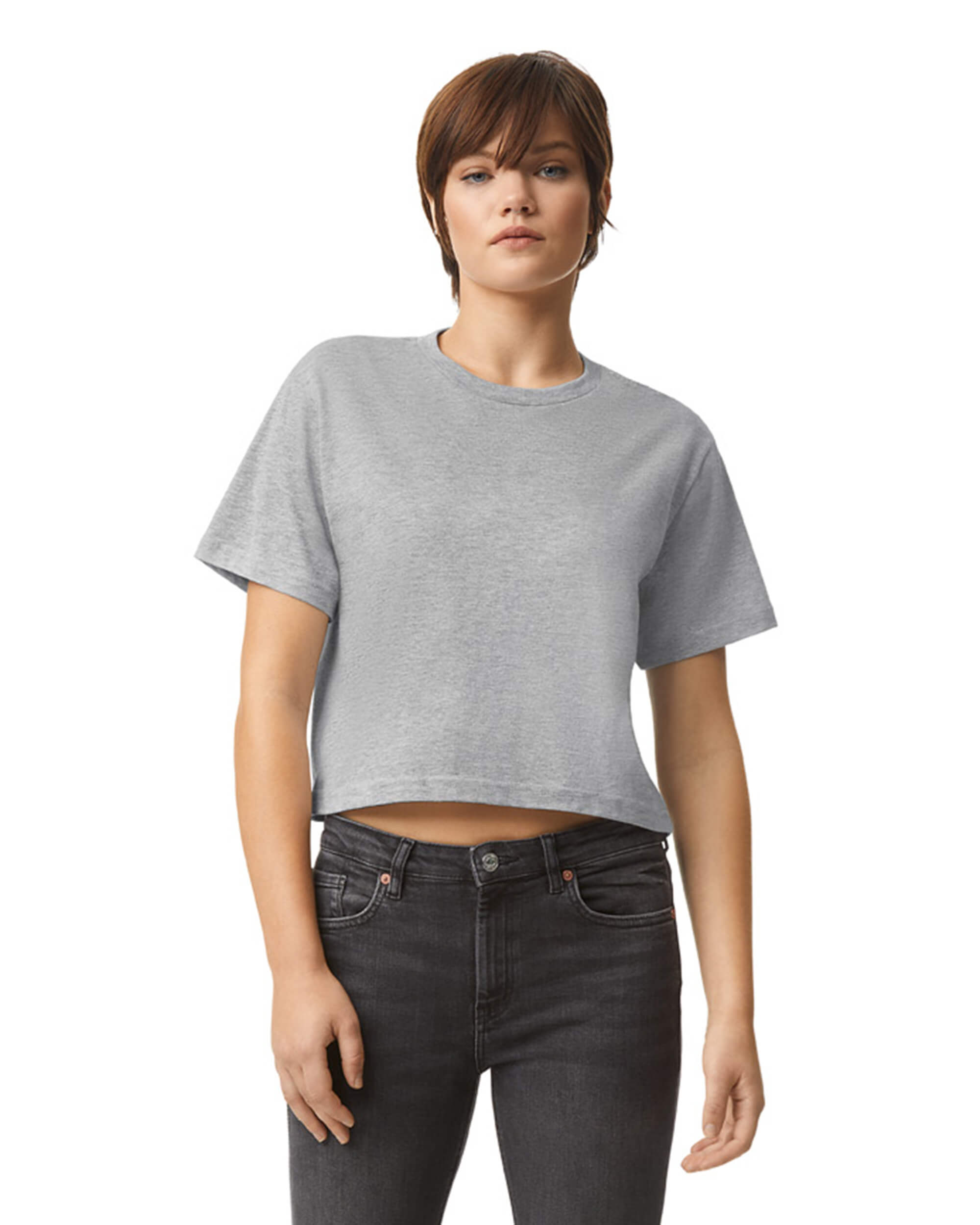 Female model wearing an American Apparel Fine Jersey Women's Boxy Tee in Heather Sport Grey, paired with black jeans, standing against a plain background (front pose) -heather sport grey