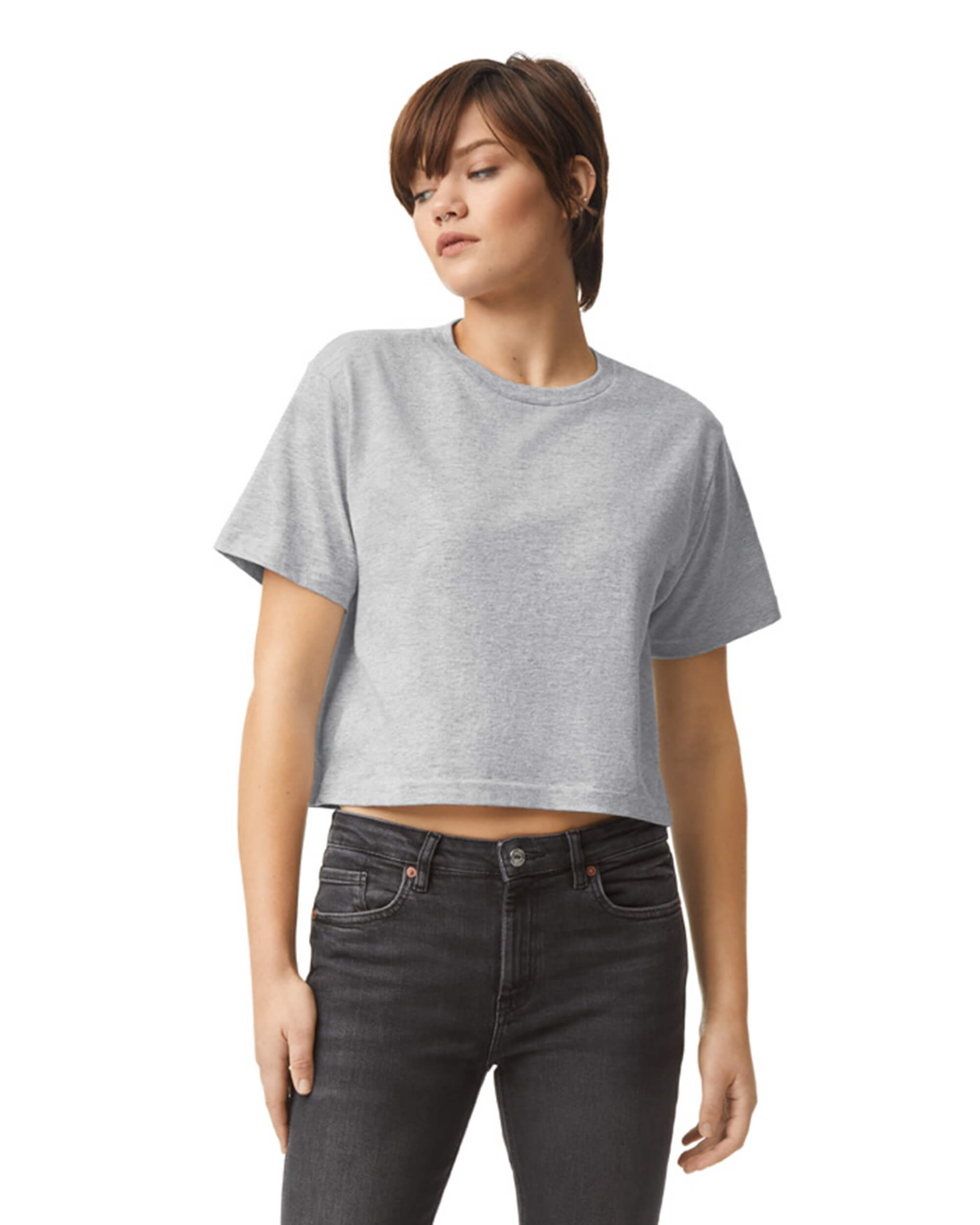 Female model wearing an American Apparel Fine Jersey Women's Boxy Tee in Heather Sport Grey, paired with black jeans, standing against a plain background (front pose) -heather sport grey