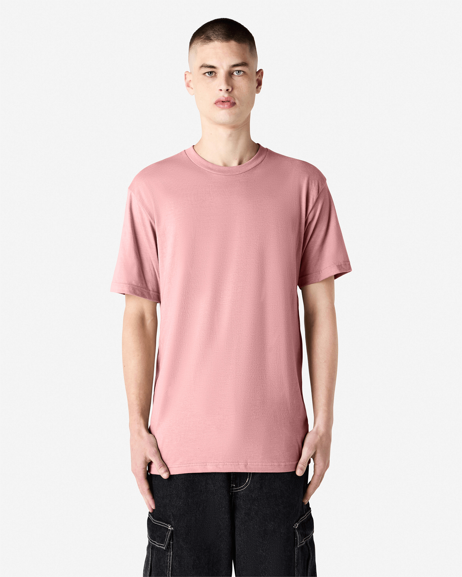 Male model wearing heather blush colour CVC Unisex Short Sleeve Crew Neck Tee (front pose) -heather blush