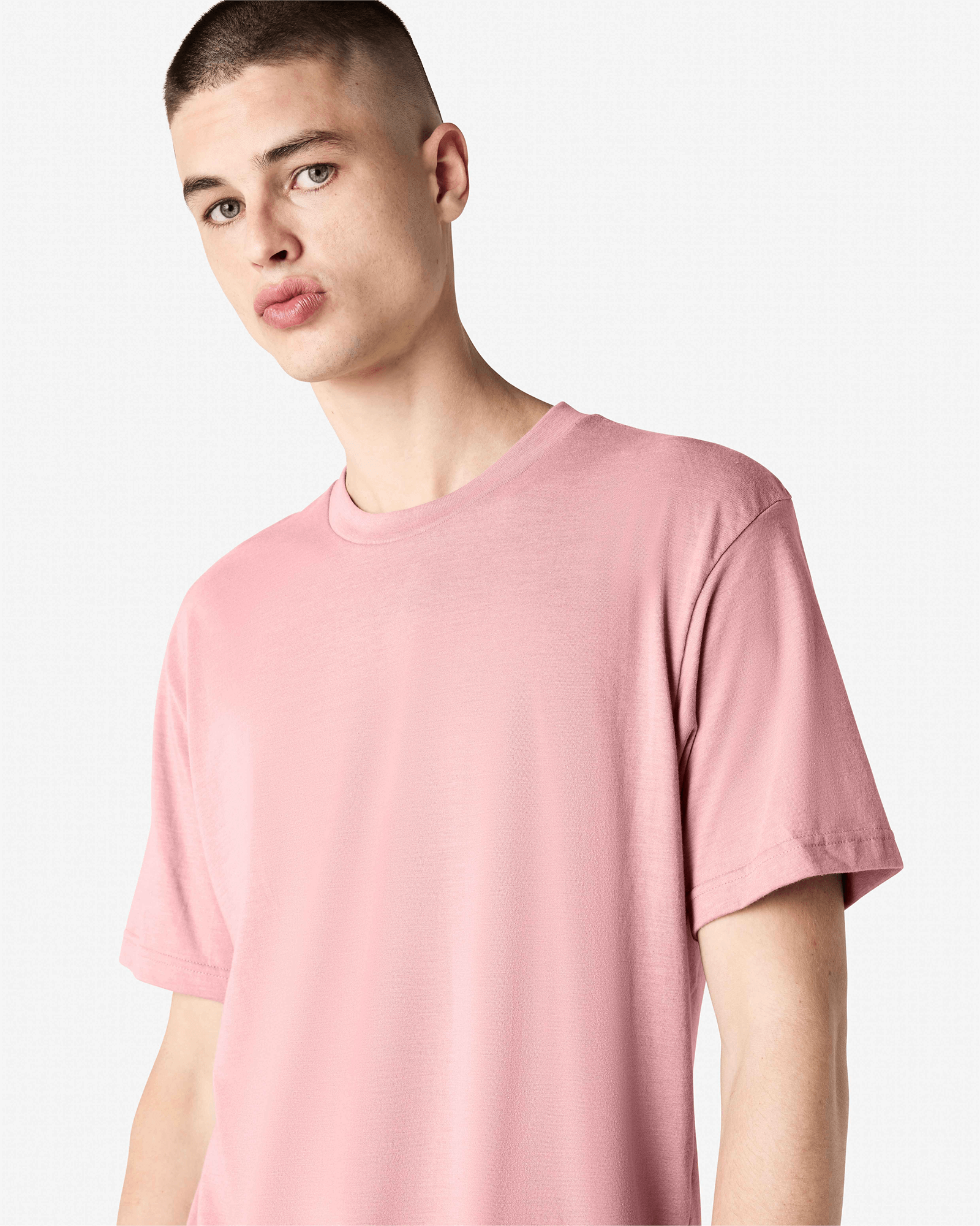 Male model wearing heather blush colour CVC Unisex Short Sleeve Crew Neck Tee (front pose) -heather blush