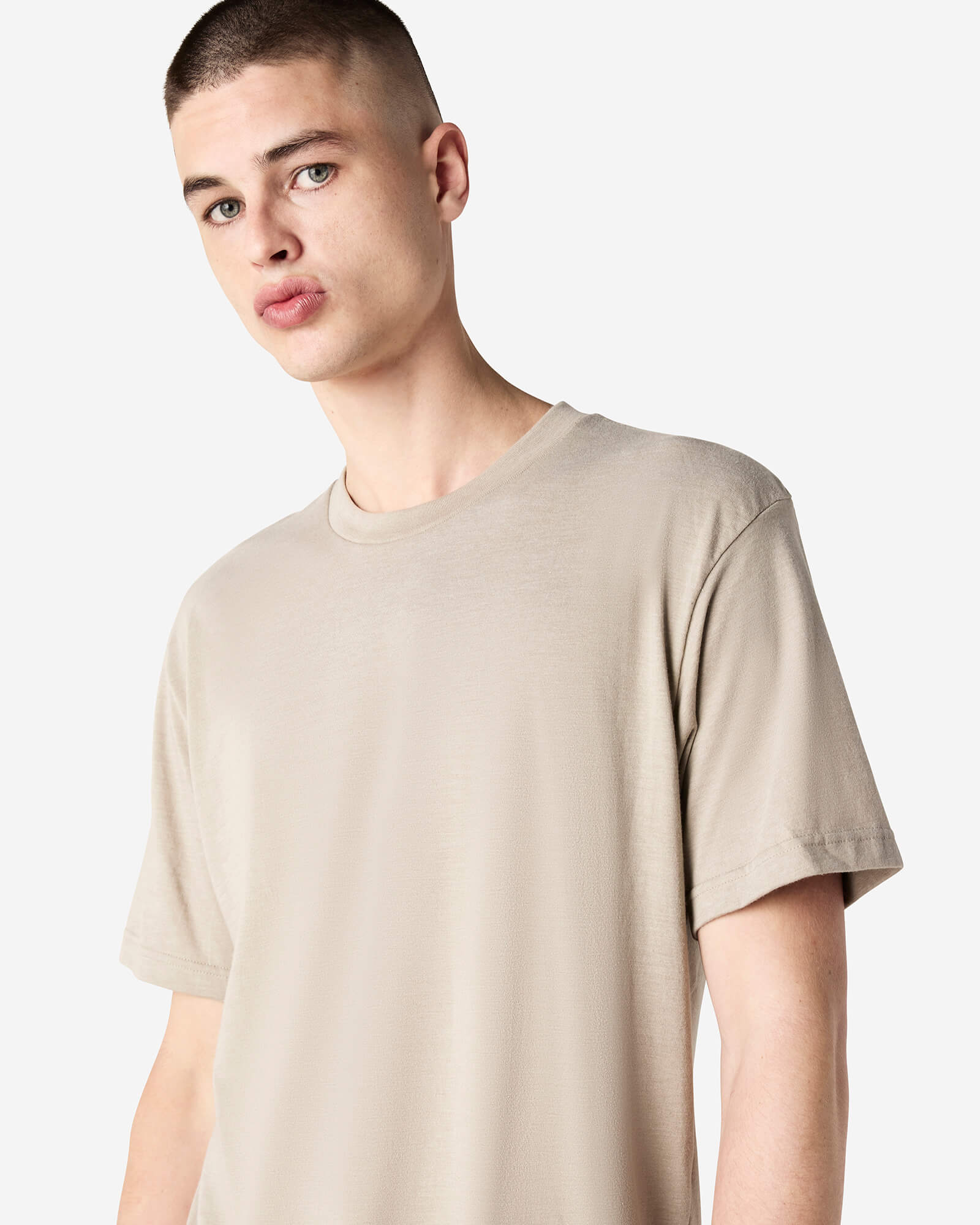 Male model wearing heather bone colour CVC Unisex Short Sleeve Crew Neck Tee (front pose) -heather bone