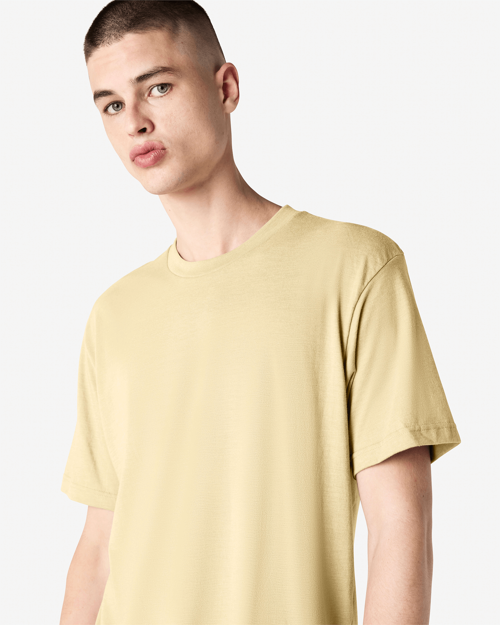 Male model wearing heather cream colour CVC Unisex Short Sleeve Crew Neck Tee (front pose) -heather cream