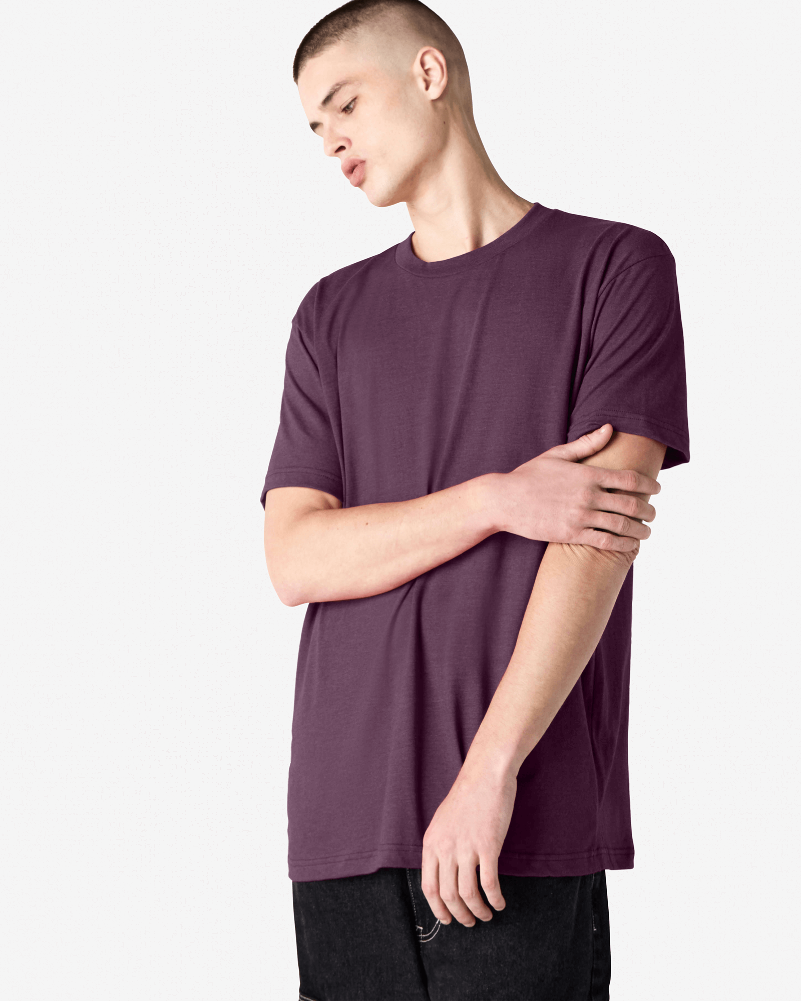 Male model wearing heather eggplant colour CVC Unisex Short Sleeve Crew Neck Tee (front pose) -heather eggplant