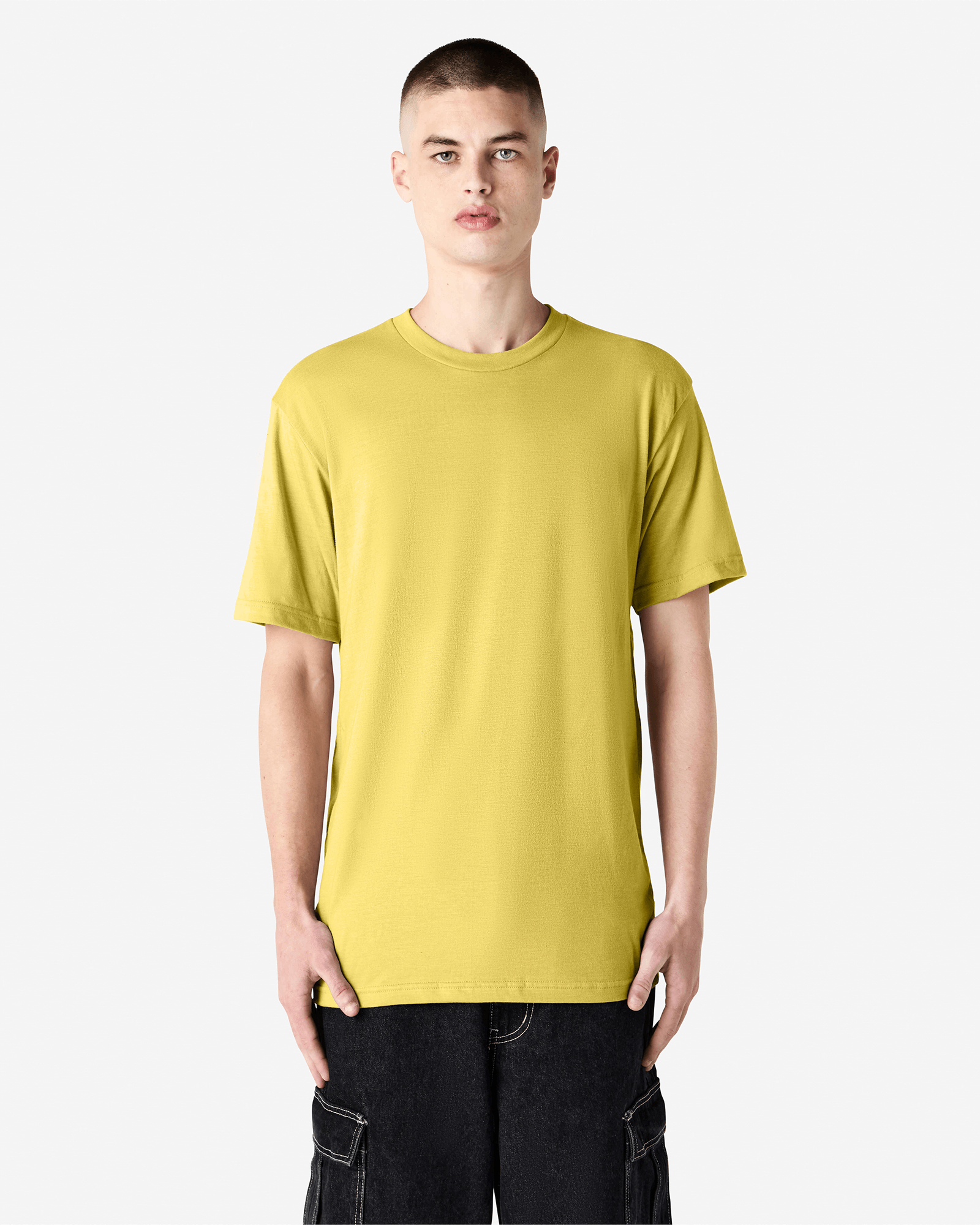 Male model wearing heather pannacotta colour CVC Unisex Short Sleeve Crew Neck Tee (front pose) -heather pannacotta