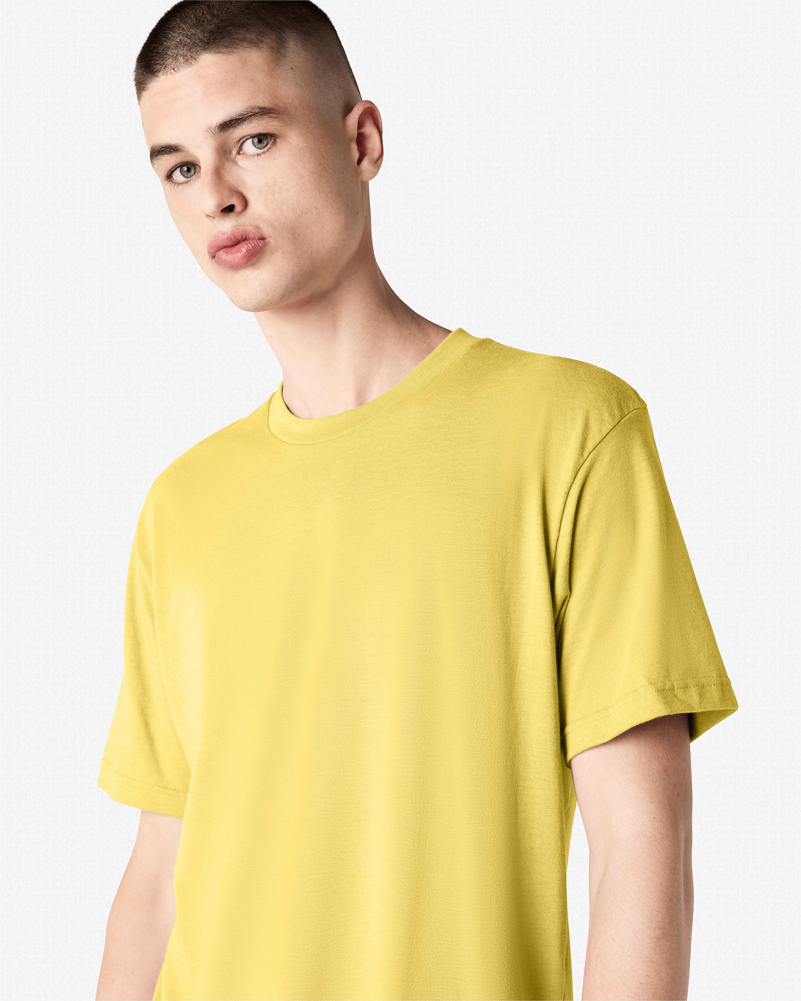 Male model wearing heather pannacotta colour CVC Unisex Short Sleeve Crew Neck Tee (front pose) -heather pannacotta