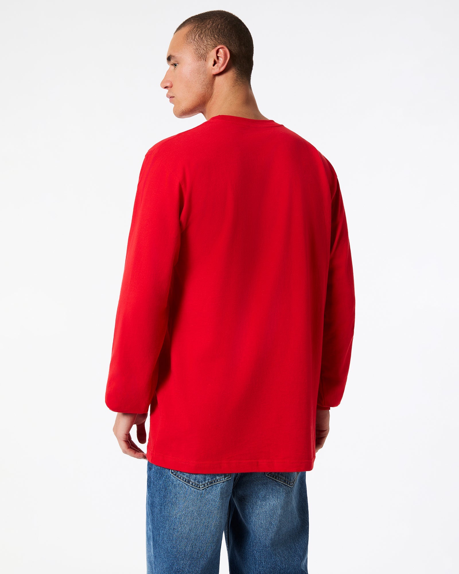 male model wearing American Apparel Red Colour Fine Jersey Unisex Long Sleeve Crew Neck T-shirt- Back pose