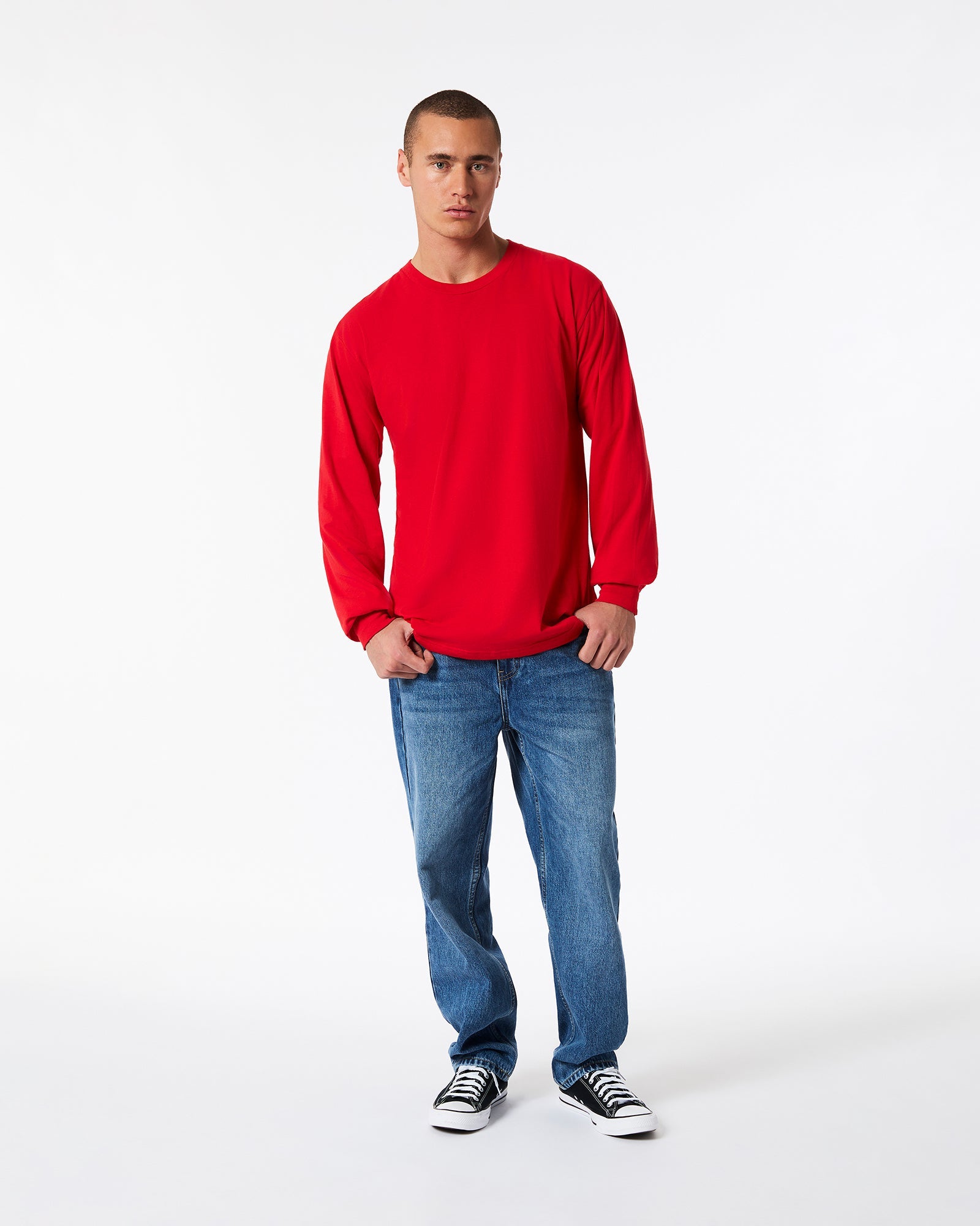 male model wearing American Apparel Red Colour Fine Jersey Unisex Long Sleeve Crew Neck T-shirt- Front pose