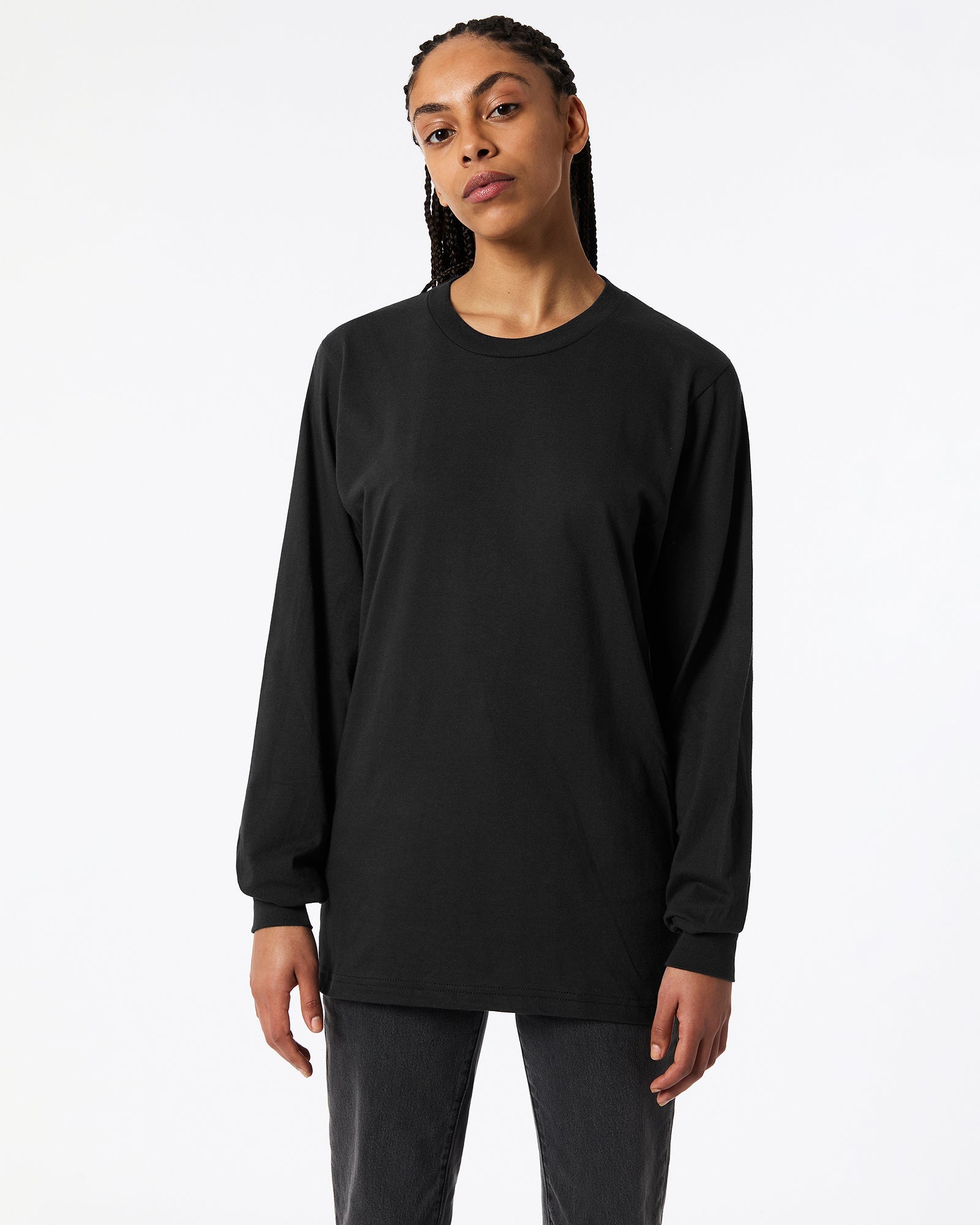 Female model wearing Black Colour Fine Jersey Unisex Long Sleeve Crew Neck T-shirt- Front pose