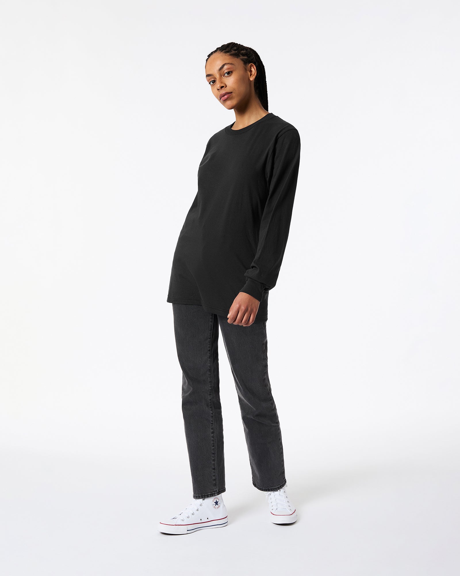 Female model wearing Black Colour Fine Jersey Unisex Long Sleeve Crew Neck T-shirt- Front pose