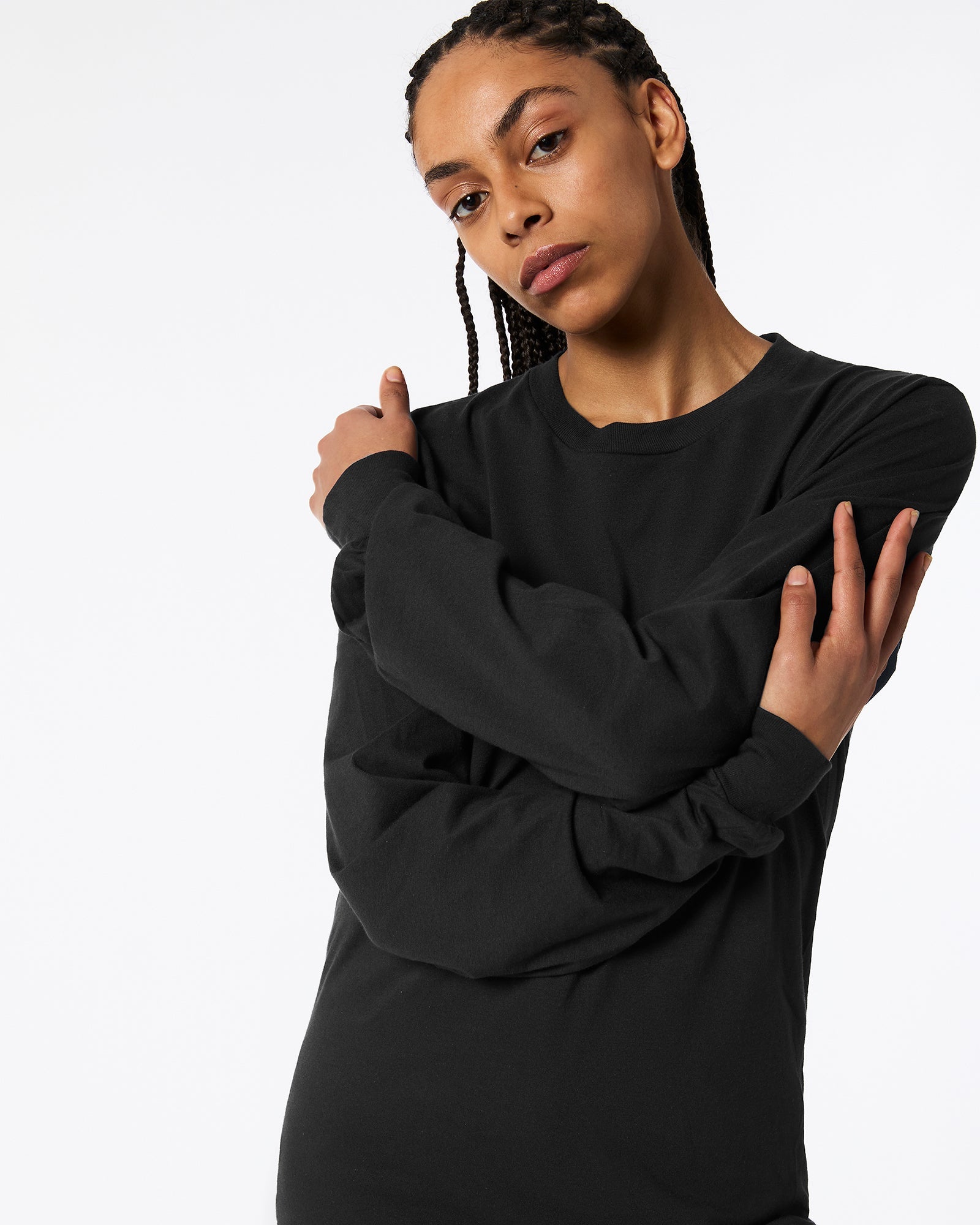 Female model wearing American Apparel Black Colour Fine Jersey Unisex Long Sleeve Crew Neck T-shirt- Front pose