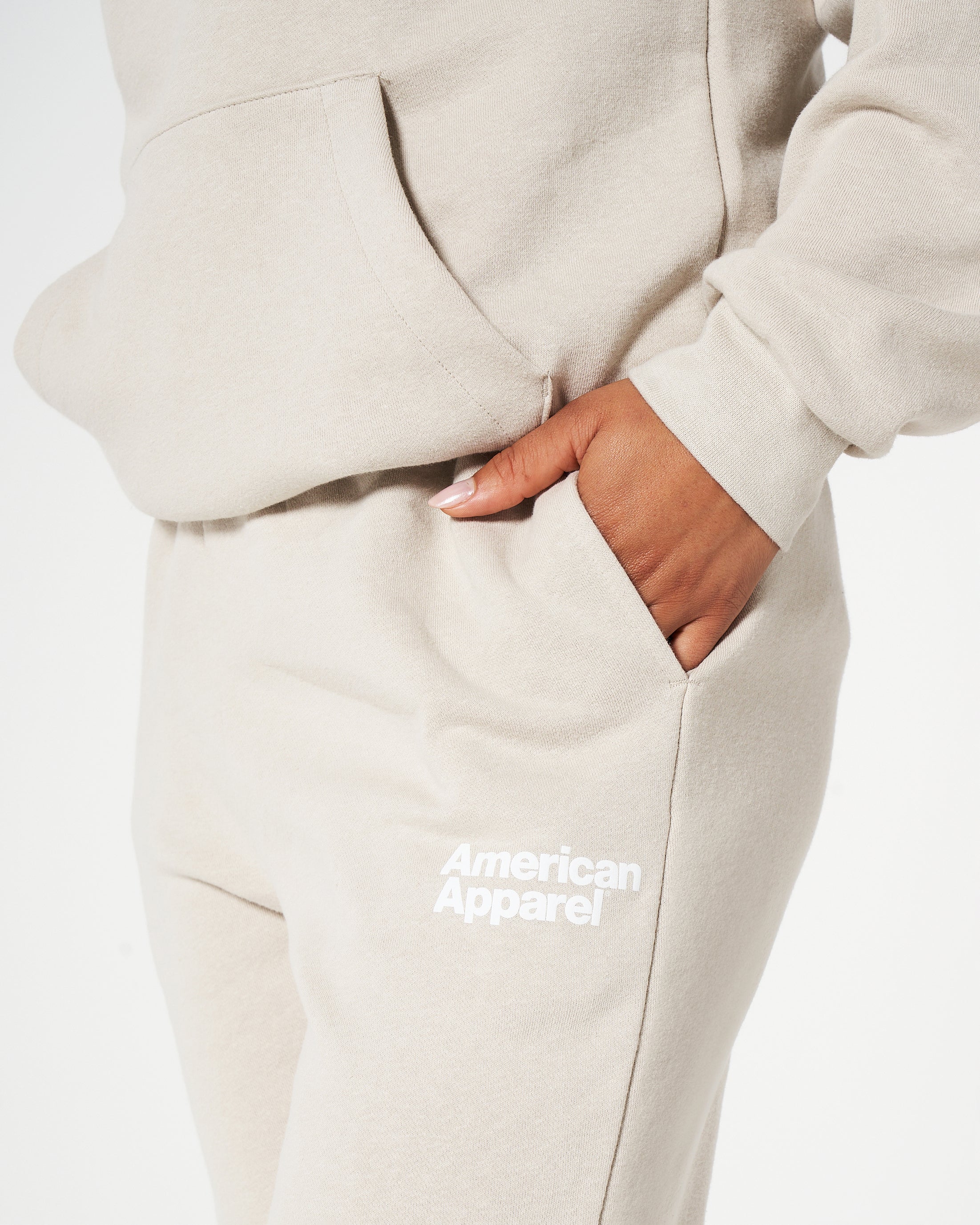 Female model wearing Bone American Apparel Pocket Puff Print Logo Tracksuit Set -bone