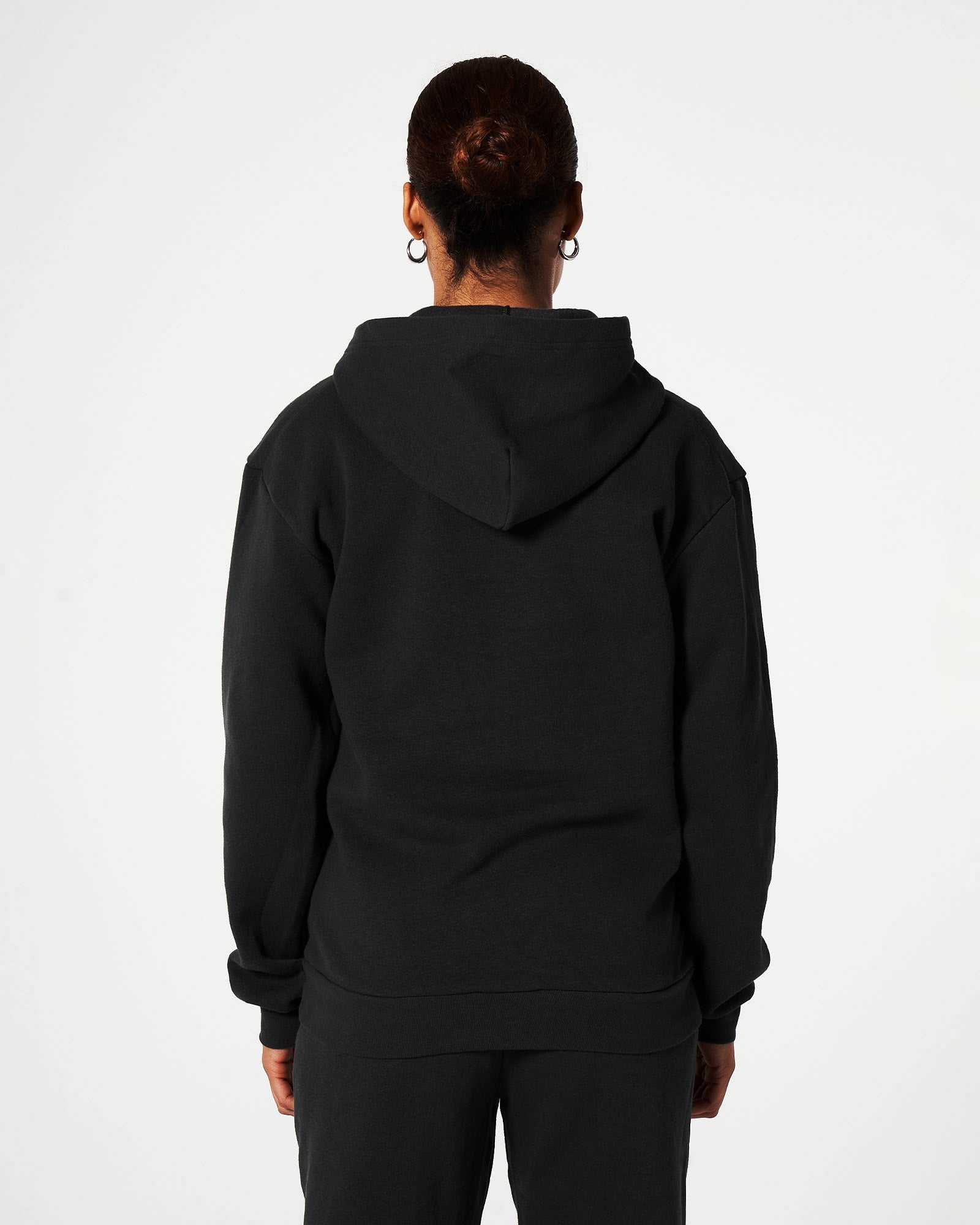 Female model wearing Black American Apparel Pocket Puff Print Logo Tracksuit Set