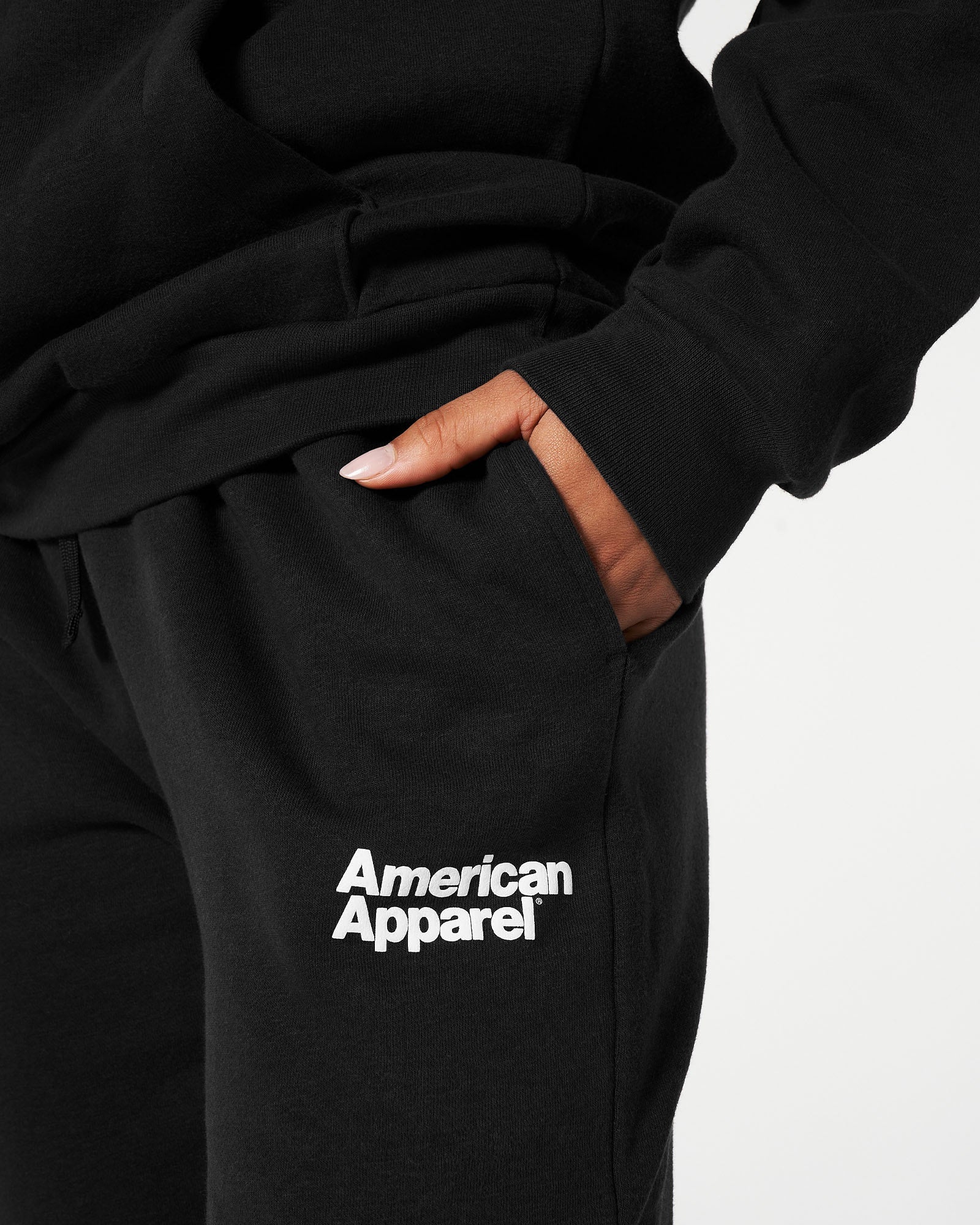 Female model wearing Black American Apparel Pocket Puff Print Logo Tracksuit Set