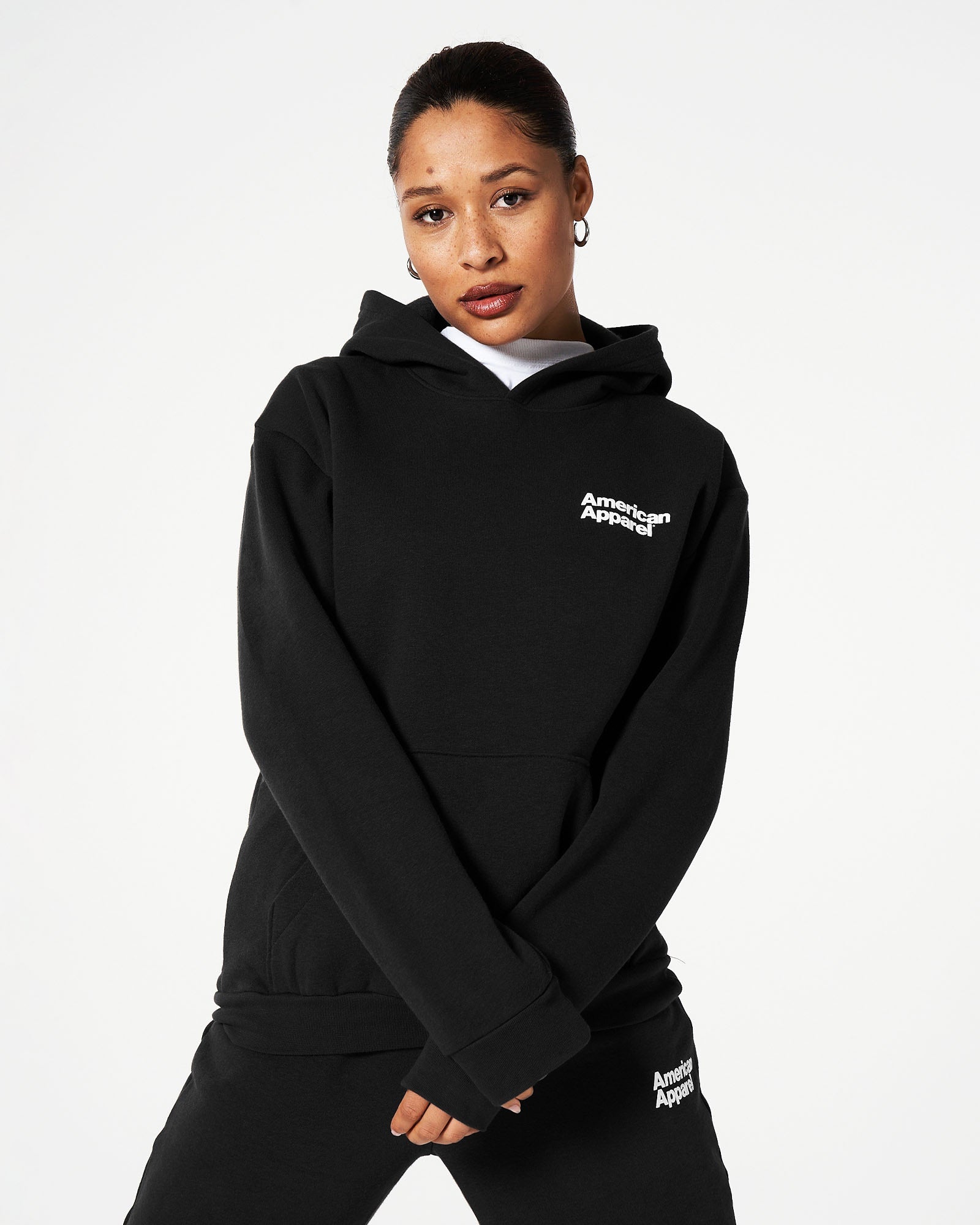 Female model wearing Black American Apparel Pocket Puff Print Logo Tracksuit Set