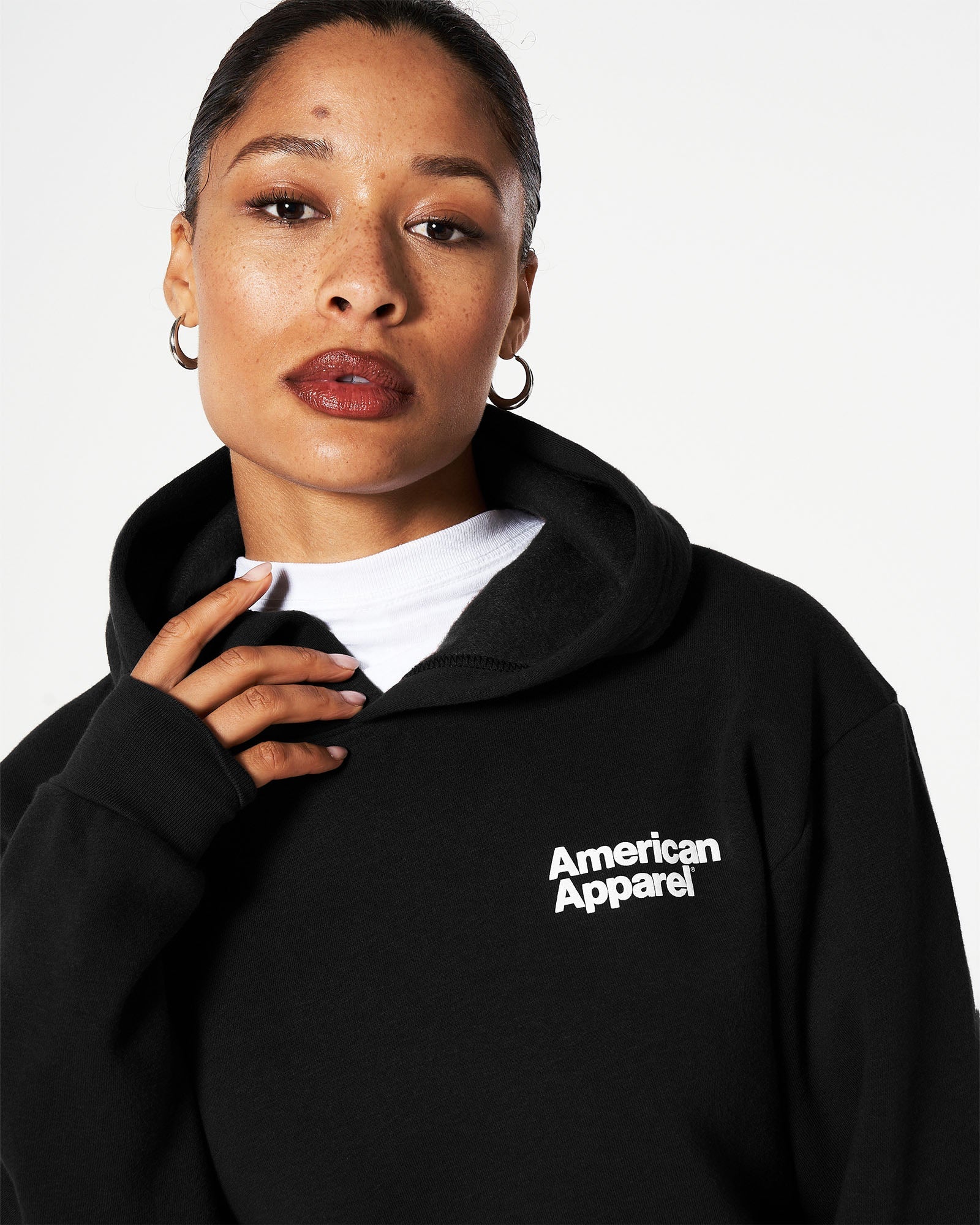 Female model wearing Black American Apparel Pocket Puff Print Logo Hoodie -black