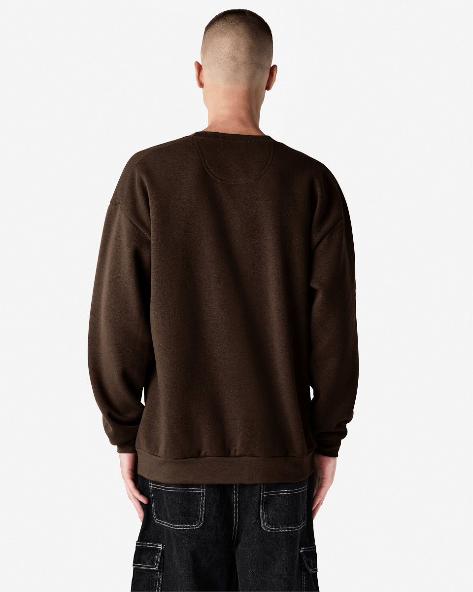 Male model wearing a Reflex Unisex Crewneck Sweatshirt (back pose) -brown