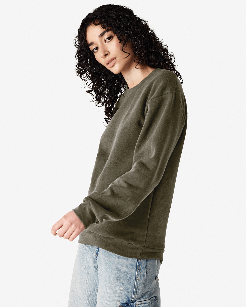 Female model wearing a Reflex Unisex Crewneck Sweatshirt (side pose) -lieutenant